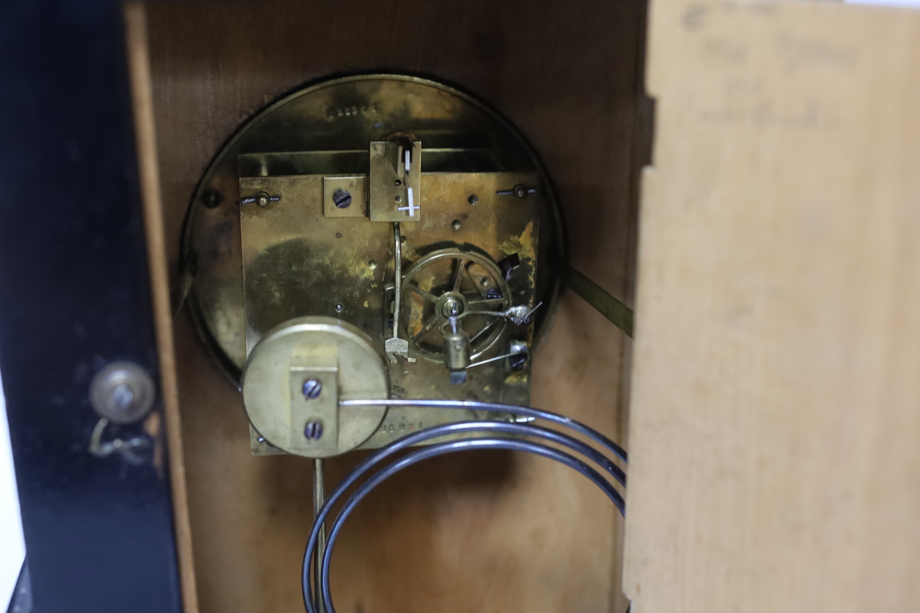 An ebonised German bracket clock with brass decoration, with a Lenzkirch movement striking on a coiled gong, 53cm high, with bracket